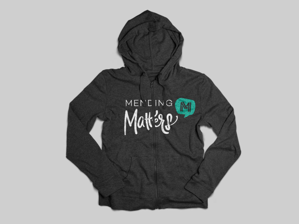 Mending Matters logo on hoodie