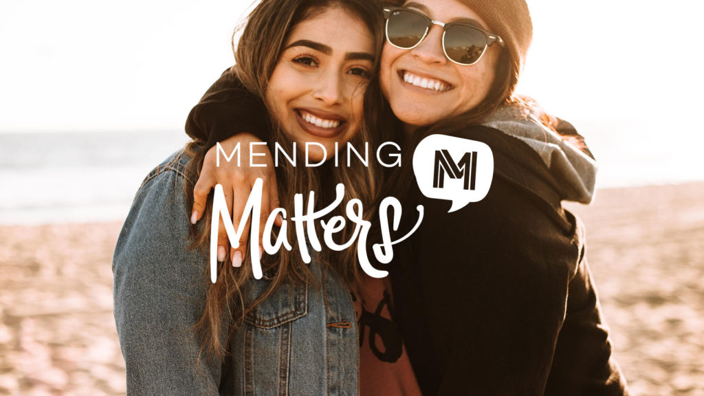 Photo of young girls with Mending Matters logo on top